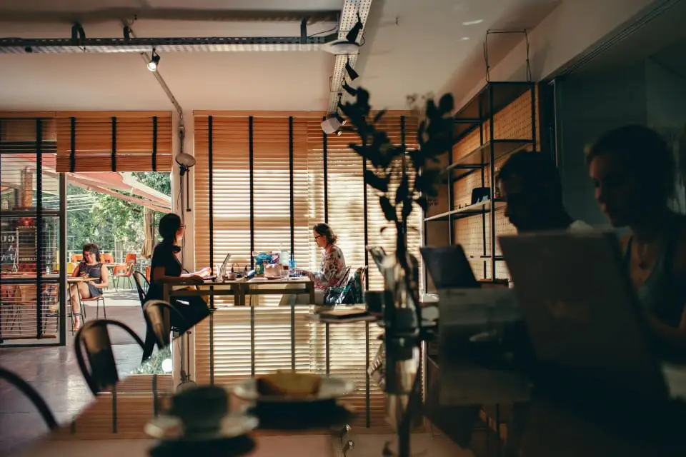 A bright café interior with customers working