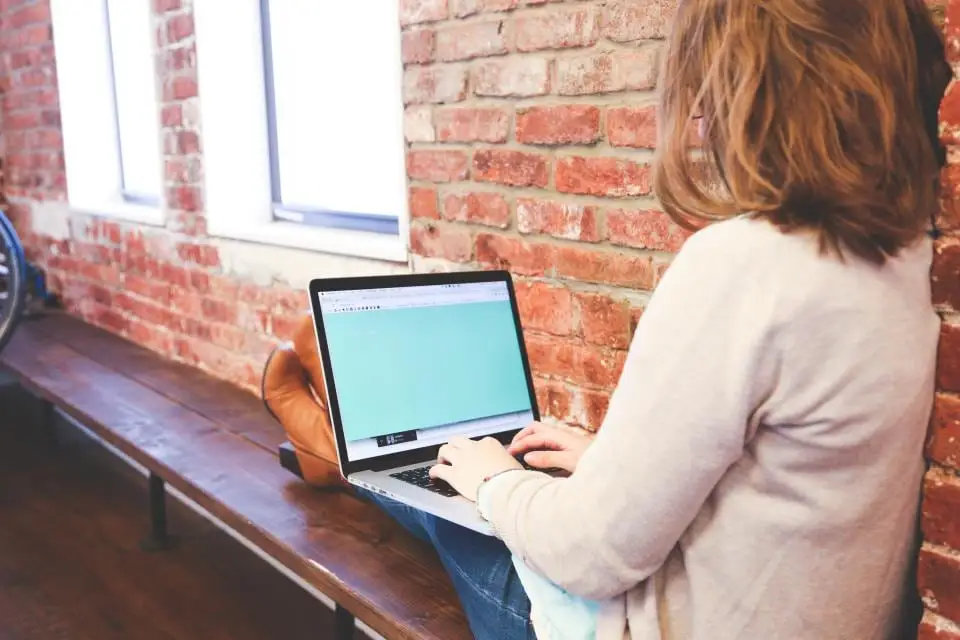 A business owner working on a laptop